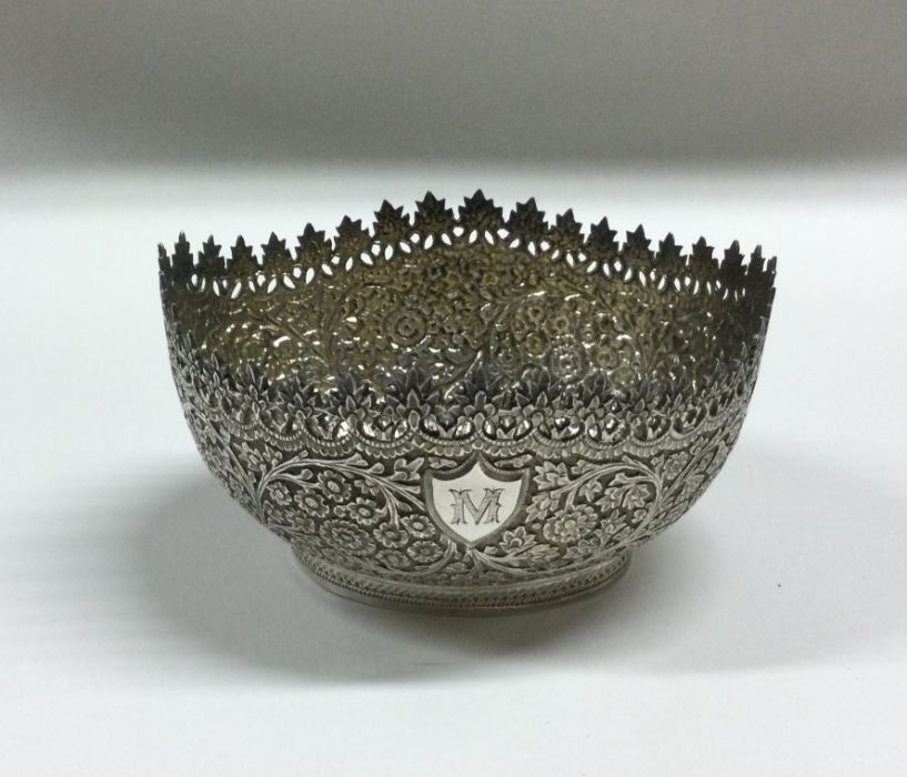 An Indian shaped silver bonbon dish with floral de