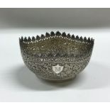 An Indian shaped silver bonbon dish with floral de