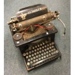 An old LS Smith typewriter. Est. £10 - £20.