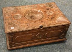 A good Georgian oak stationery box on turned suppo