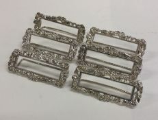 A heavy set of six silver scroll decorated menu ho