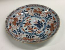 An early Chinese plate decorated with flowers and