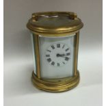 A circular brass carriage clock with chiming movem