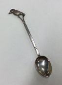 A Chinese silver spoon decorated with a bird. Appr