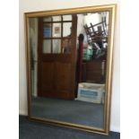 A large rectangular gilt framed mirror. Est. £50 -