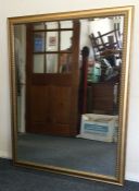 A large rectangular gilt framed mirror. Est. £50 -