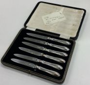 A cased set of six silver handled cake knives. Est