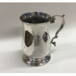 A heavy George III baluster shaped mug. Lo