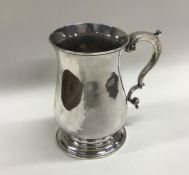 A heavy George III baluster shaped mug. Lo