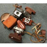 A collection of old cameras and lenses. Est. £10 -