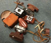 A collection of old cameras and lenses. Est. £10 -