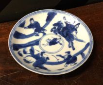 A Chinese blue and white saucer decorated with fig