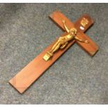 A large bronzed and wooden crucifix of typical for