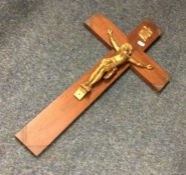 A large bronzed and wooden crucifix of typical for