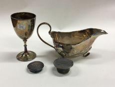 An Edwardian silver sauceboat together with a trop