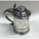 A fine Georgian silver tankard with dome top and r