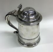 A fine Georgian silver tankard with dome top and r