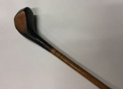 A novelty walking stick in the form of a golf club