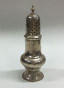 A Georgian silver sugar caster of baluster form. L