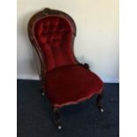 A small mahogany spoon back nursing chair. Est. £4