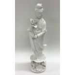 A tall Chinese figure of an Oriental lady in stand