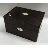 A rosewood and MOP inlaid jewellery box with fitte