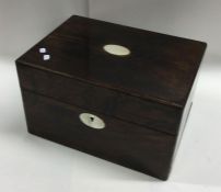 A rosewood and MOP inlaid jewellery box with fitte