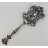 A rare silver pierced ladle decorated with flowers