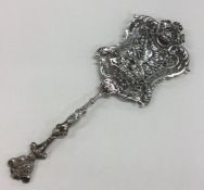 A rare silver pierced ladle decorated with flowers