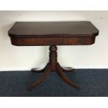 A good mahogany hinged top card table on four swee