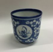 A good Chinese blue and white cup on pedestal foot