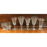 A good collection of tapering stem glasses. Est. £