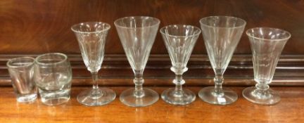 A good collection of tapering stem glasses. Est. £