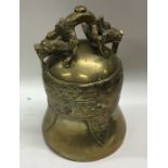 A Chinese brass bell decorated with dragons. Appro