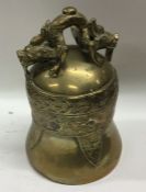 A Chinese brass bell decorated with dragons. Appro