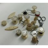 A selection of ivory and other bobbins and thread