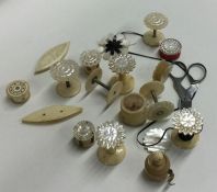 A selection of ivory and other bobbins and thread