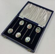 An attractive set of six silver and enamelled spoo