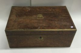 A burr walnut and brass mounted writing slope. Est