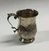 An Edwardian silver chased christening mug. Birmin