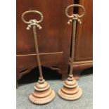 A good pair of brass door stops with ropetwist dec