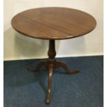 A good mahogany hinged top table on three spreadin