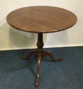 A good mahogany hinged top table on three spreadin