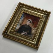An attractive painted miniature depicting a lady i