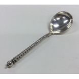 A heavy large Russian silver spoon with twisted ha