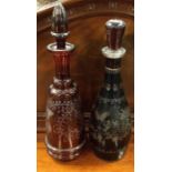 Two ruby glass etched decanters. Est. £20 - £30.