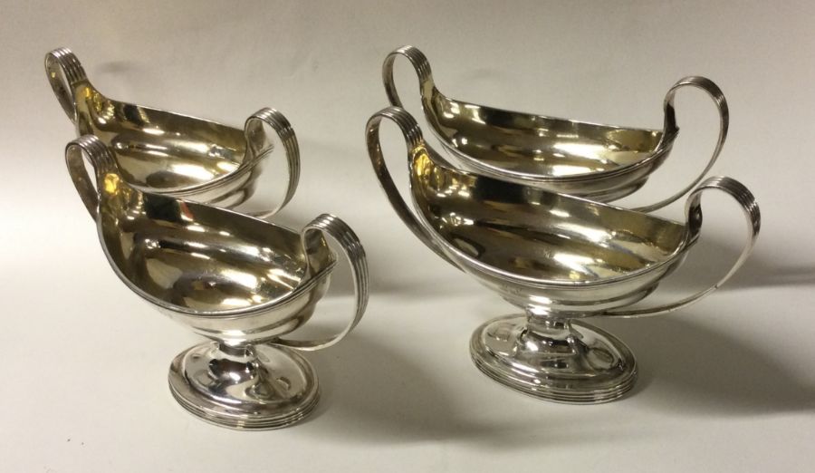 A rare set of four George III silver two handled s