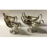 A rare set of four George III silver two handled s