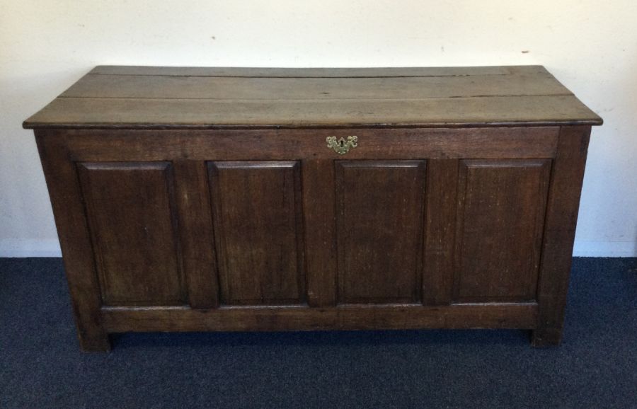 A Georgian oak hinged top coffer. Est. £60 - £80.