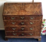 A good burr walnut veneer four drawer fall flap bureau with oak sides. E